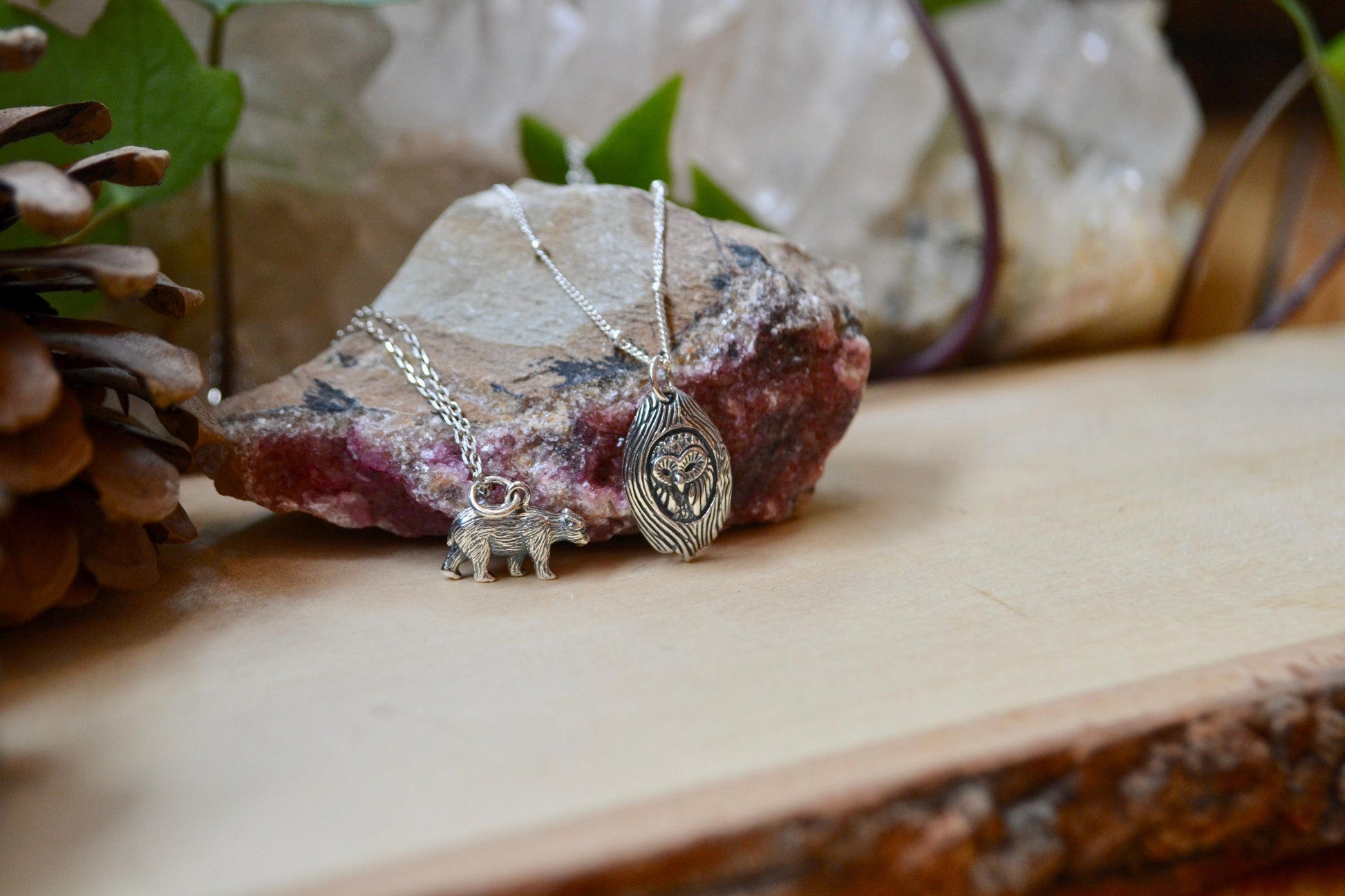 Detailed owl and bear necklaces