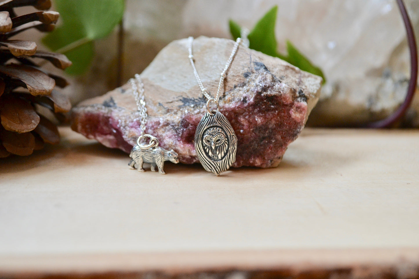 Detailed owl and bear necklaces