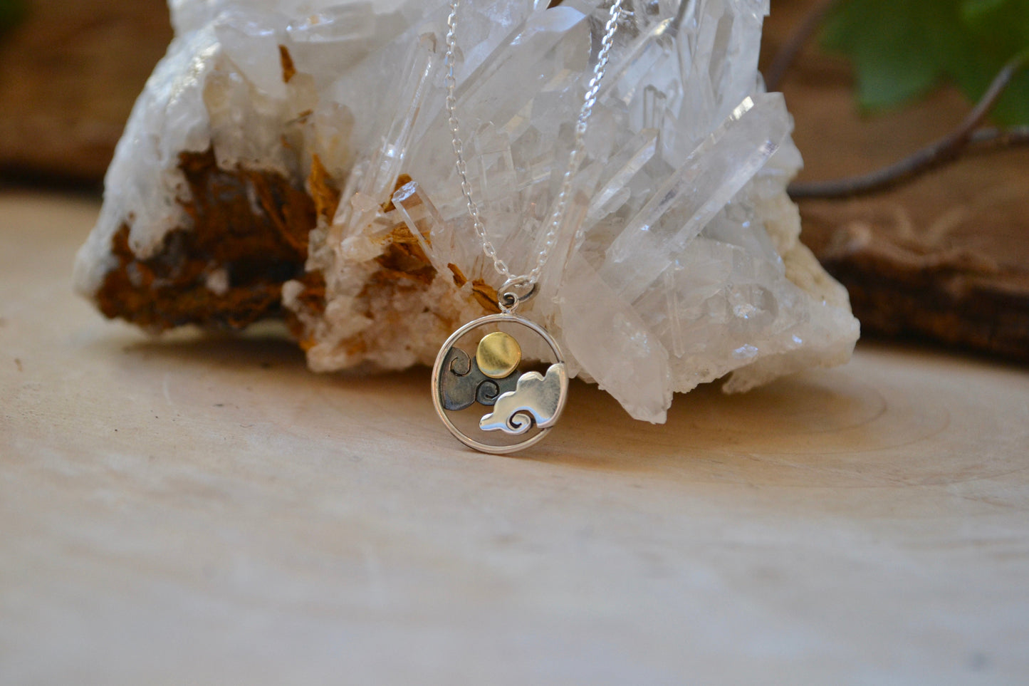 Clouds with sun necklace