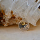 Clouds with sun necklace